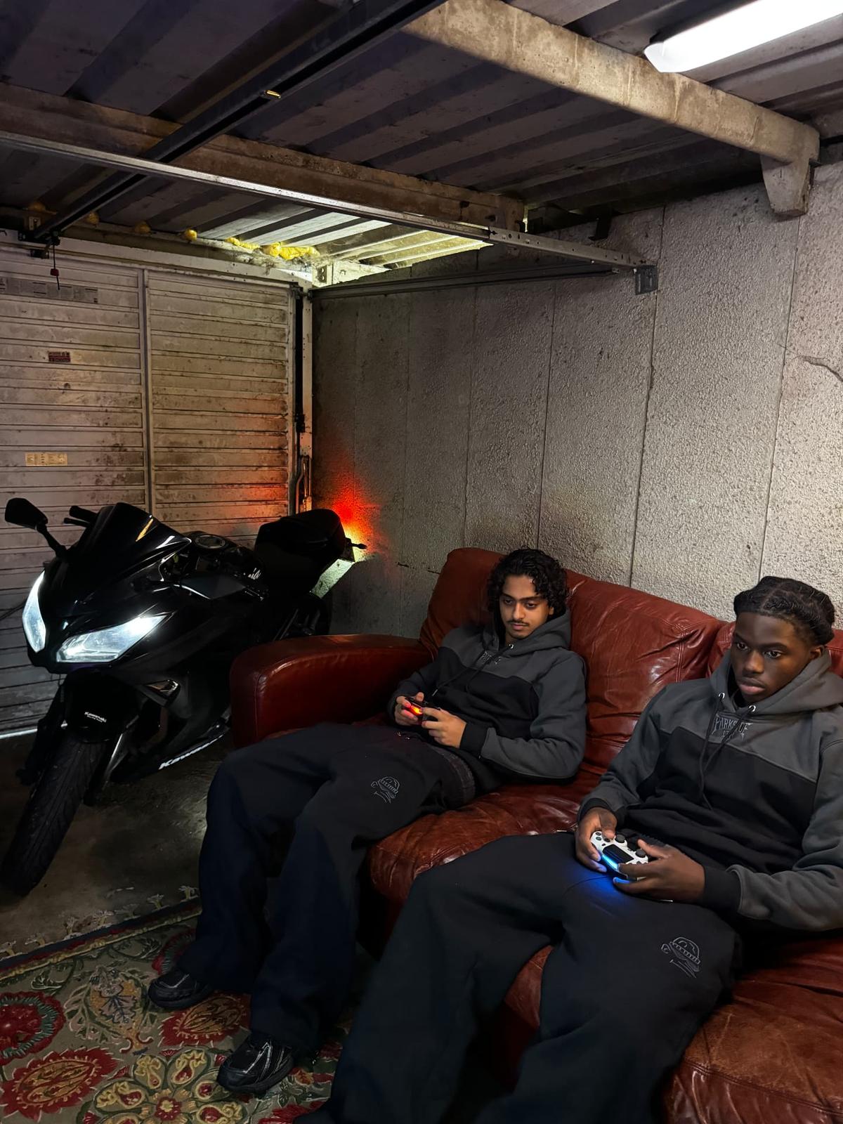 Parkside black tracksuit full set — seated front view