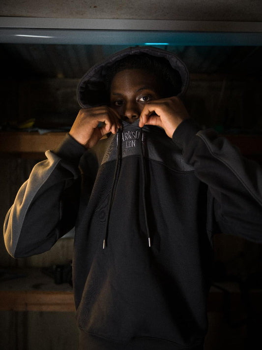 Parkside black hoodie — hood up, embroidered chest detail